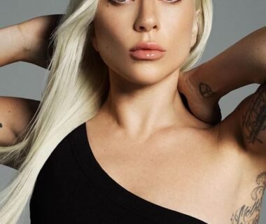 Lady Gaga in black dress with blond hair